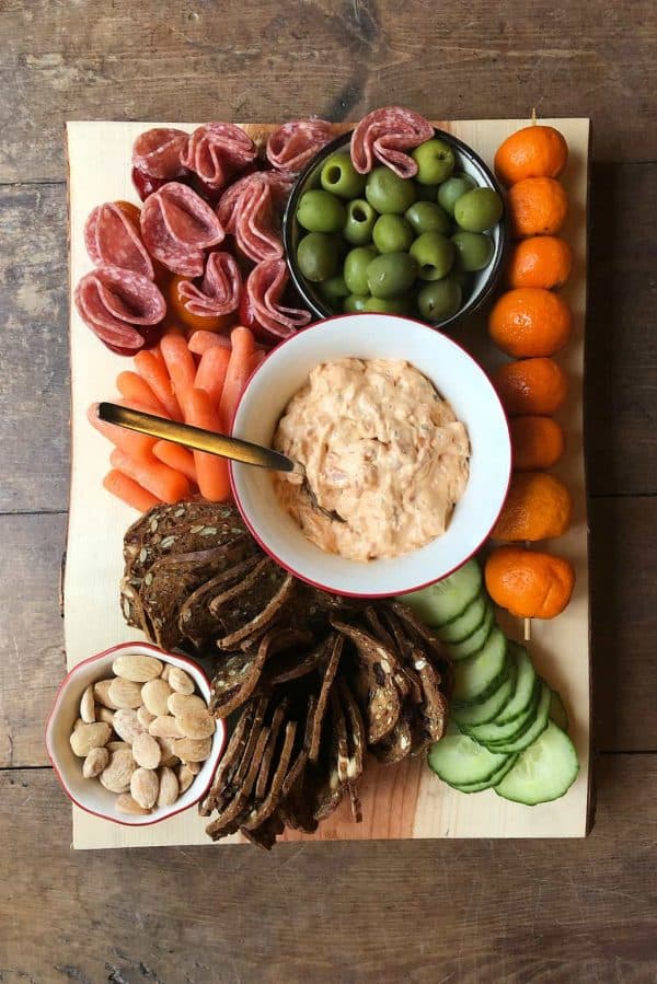 board with a bowl of smoked salmon dip