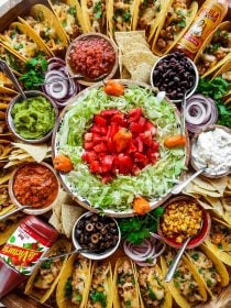 beautiful round taco spread on an epic board