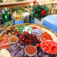 epic round board filled with red, white and blue charcuterie foods