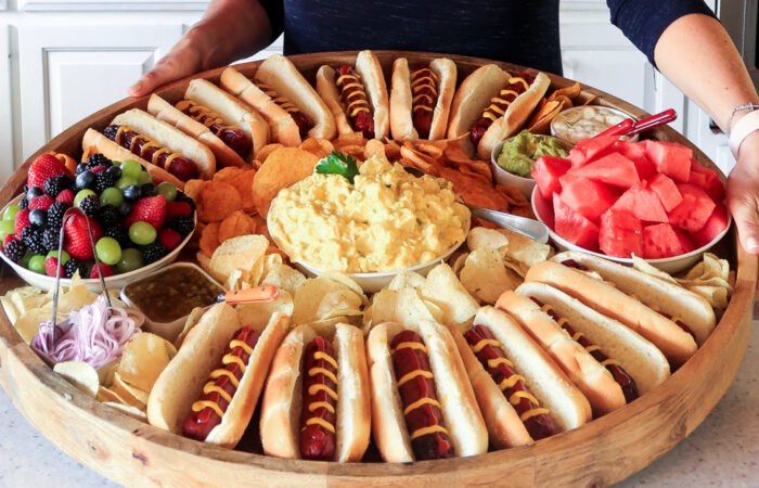 woman holding an Epic Hot Dog Board