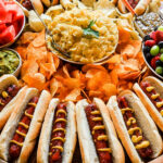 potato salad in center of hot dog boards