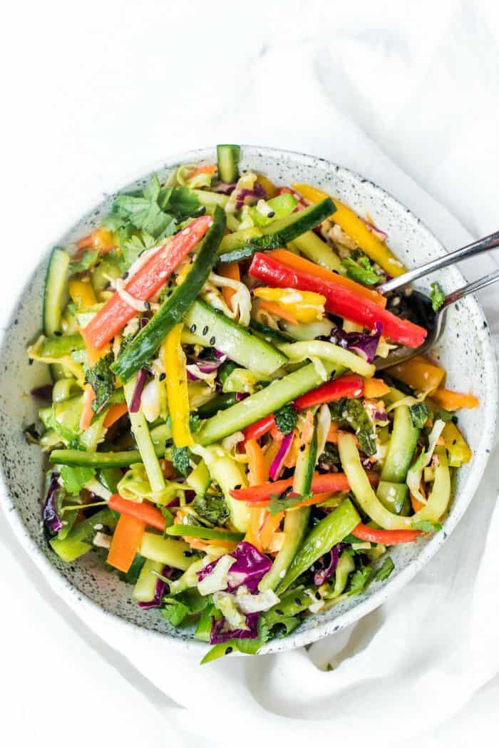 mixed vegetables with dressing in a bowl