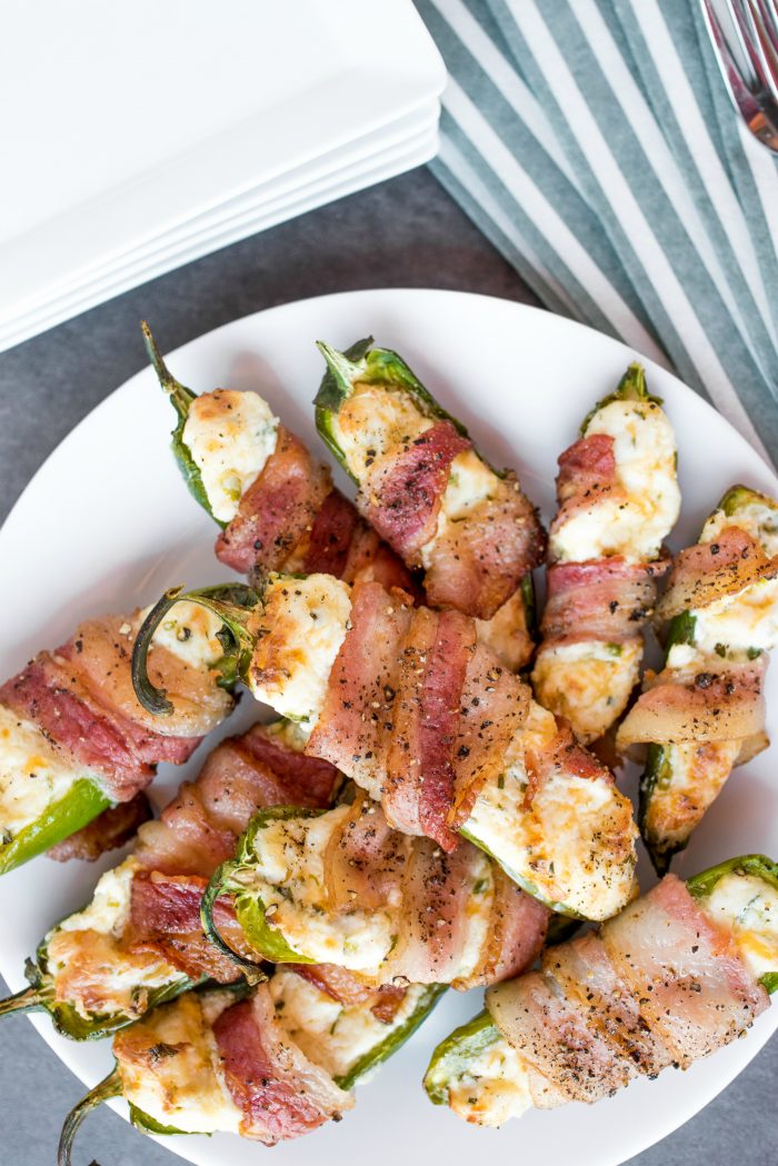 a white plate of Bacon-Wrapped Air Fryer Cheesy Jalapeño Poppers