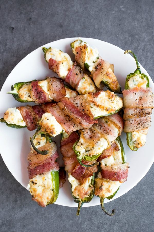 a white plate of Bacon-Wrapped Air Fryer Cheesy Jalapeño Poppers