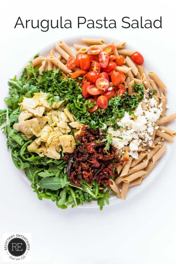 round plate of arugula pasta salad ingredients