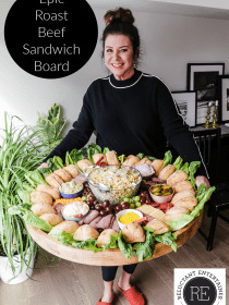 woman holding an Epic Roast Beef Sandwich Board