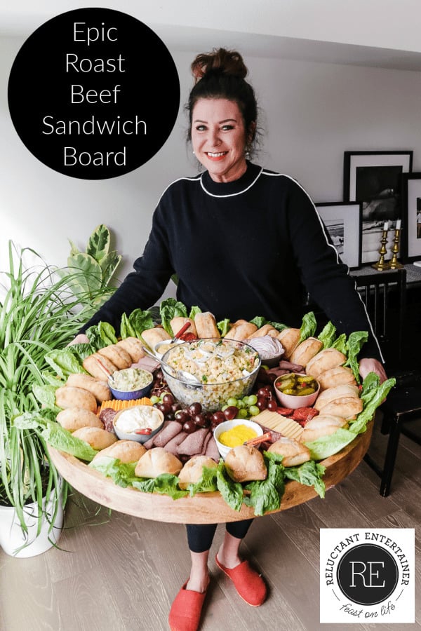 woman holding an Epic Roast Beef Sandwich Board