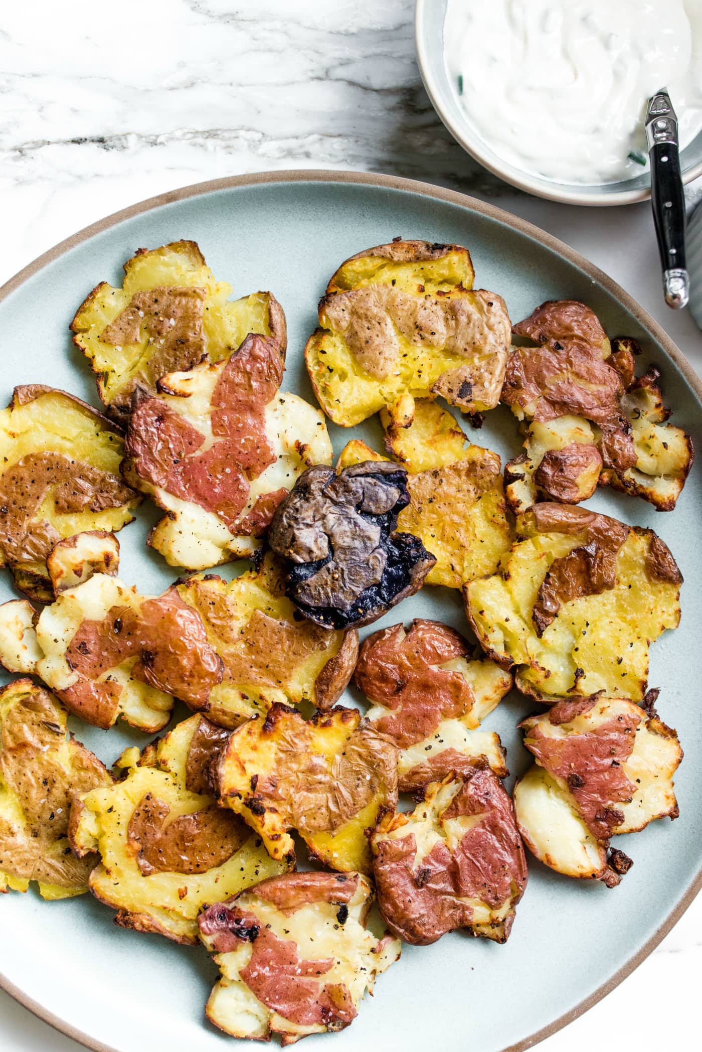 Crispy Smashed Potatoes with Pickles and Gin-Spiked Sour Cream