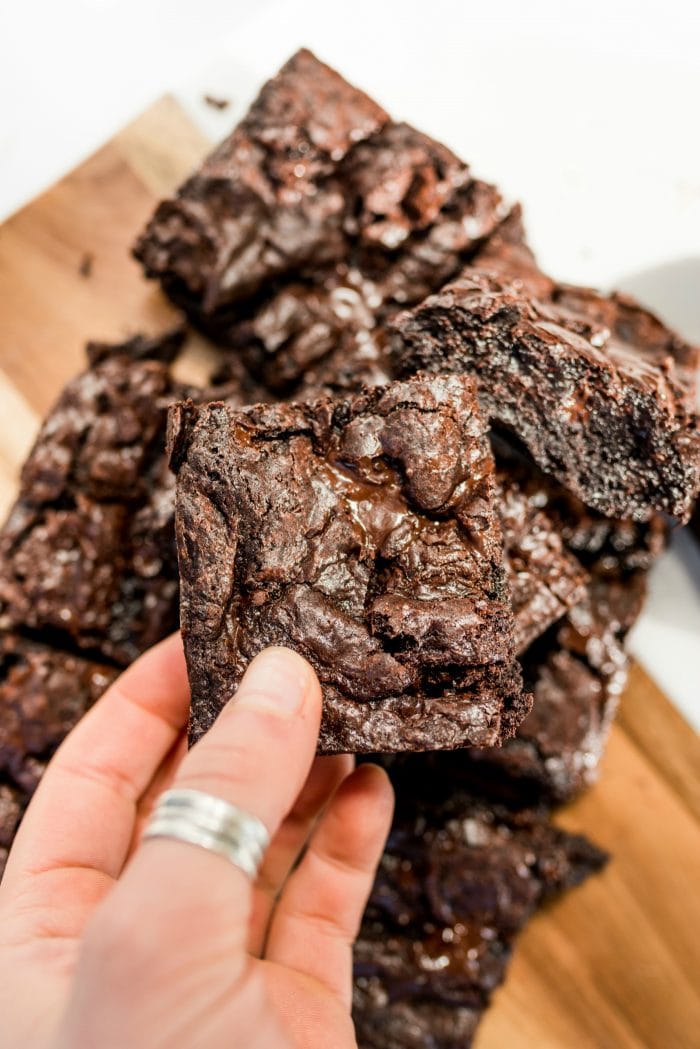 a close up shot of a square piece of Homemade Chocolate Fudge Brownie