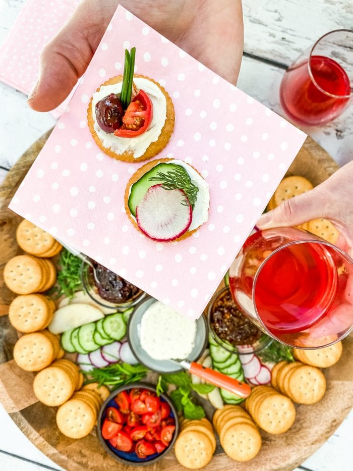 pink polka dot napkin with 2 cracker bites (with soft cheese and veggie slices)