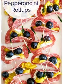 12 pieces of salami with cream cheese, blueberries, and pepperoncinis