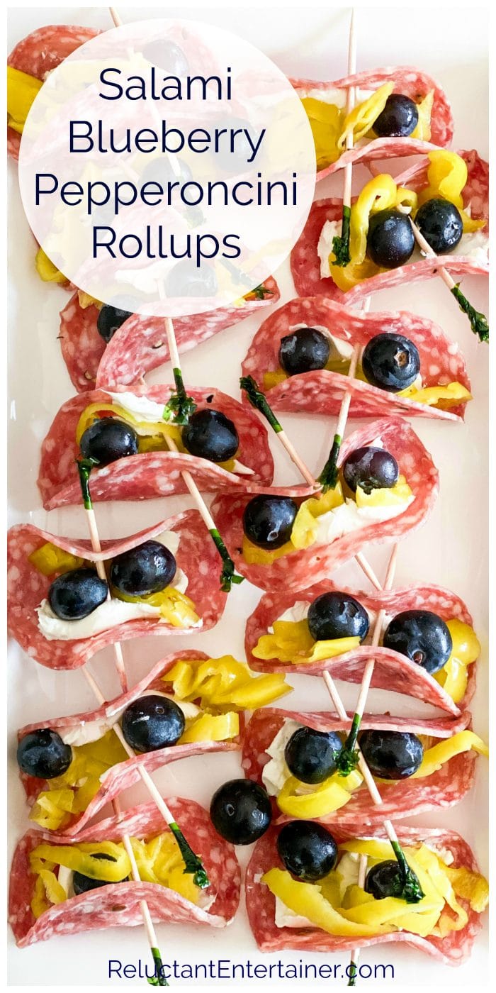 12 pieces of salami with cream cheese, blueberries, and pepperoncinis