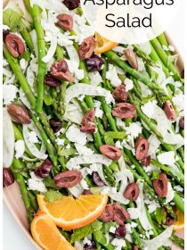 close up of Shaved Fennel Asparagus Salad with a slice of orange