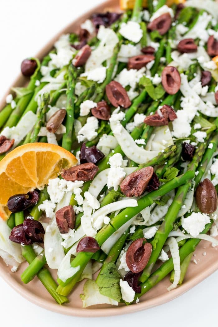 close up view of Shaved Fennel Asparagus Salad with kalamata olives and feta cheese