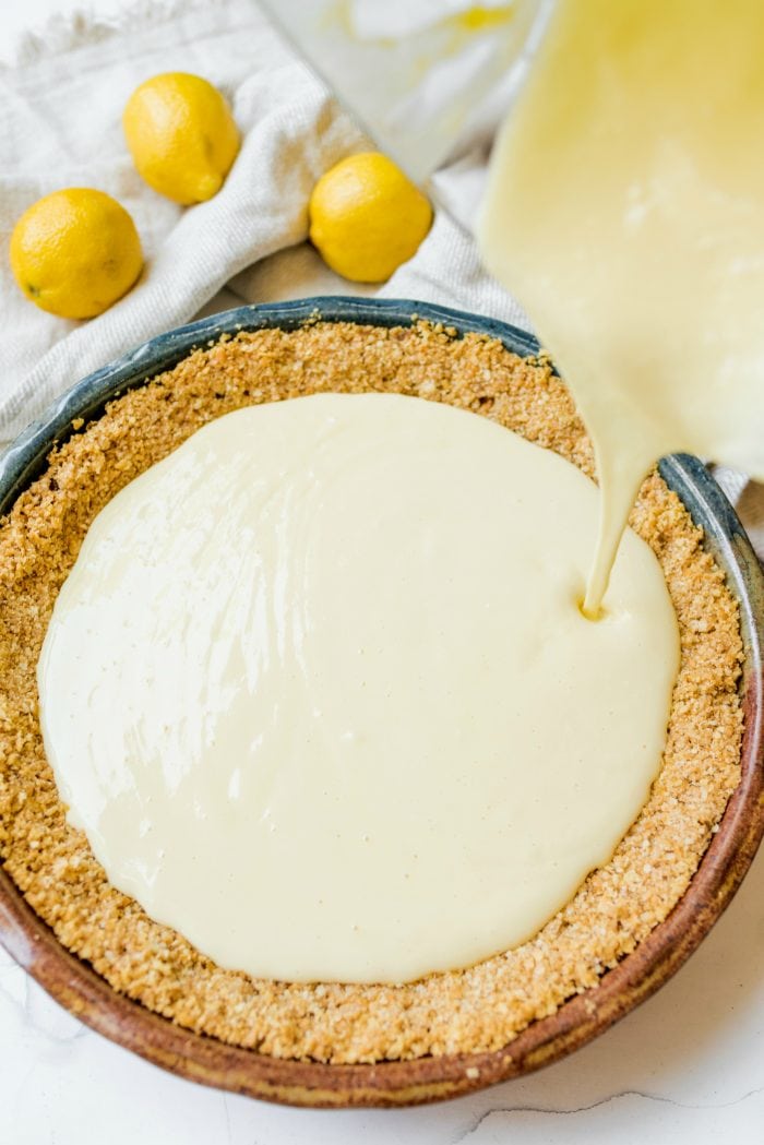 looking down on a Ritz cracker pie crust with poured lemon filling