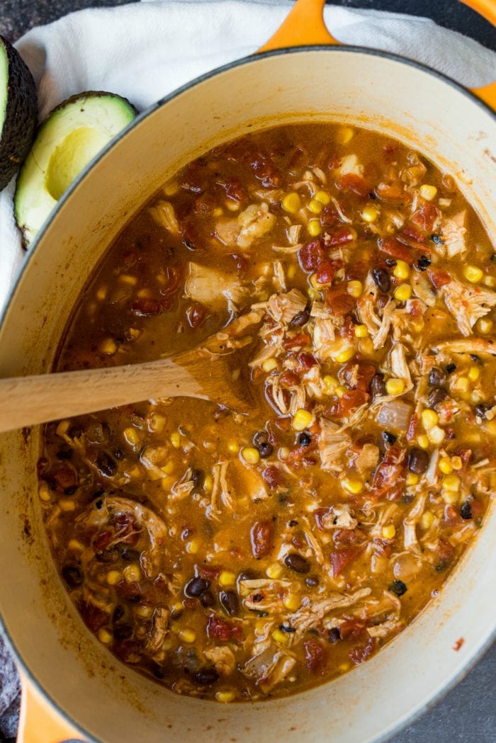 close up of chicken tortilla soup with black beans and corn