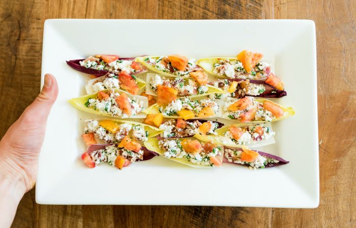 platter of BLT Endive Bites with heirloom tomatoes