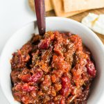 white bowl of chutney made with apricots and cherries