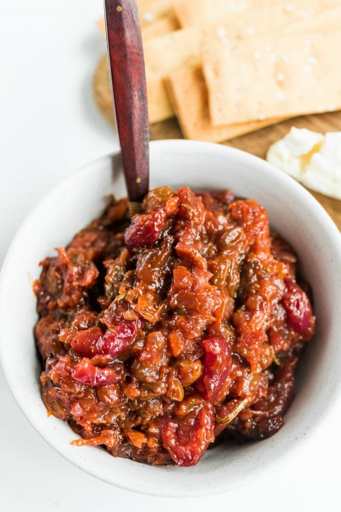 white bowl of chutney made with apricots and cherries