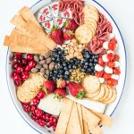 oval tray with red, white, and blue foods for the 4th of july