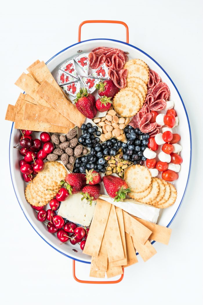 oval tray with red, white, and blue foods for the 4th of july
