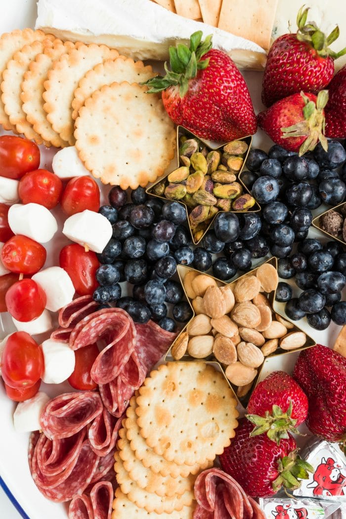 red, white, and blue cheese, crackers, and fruit