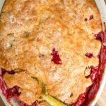 a summer cobbler with red fruit