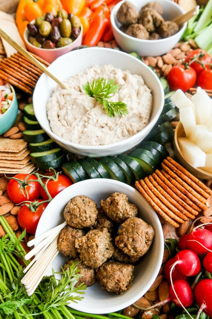 vegan hummus and meatballs on a veggie platter