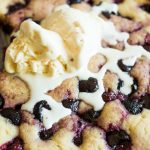 up close cherry buttermillk cake with melted ice cream