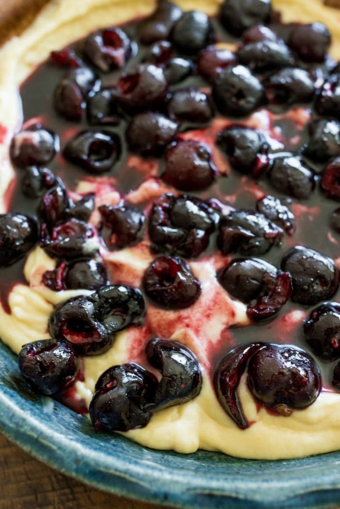 buttermilk cake batter with juicy red cherries