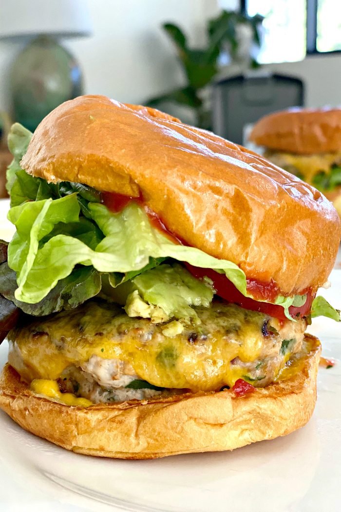 a Savory Turkey Burger with cheese, lettuce, ketchup