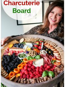 woman holding a big board wil colorful snacks