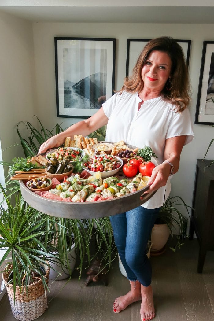 a woman holding a Summer Mediterranean Board