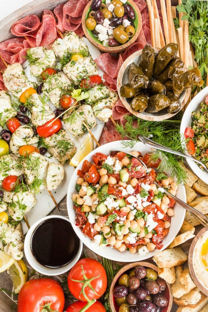 close up of fish kebabs, and chickpea salad