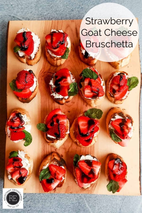 wood board with Strawberry Goat Cheese Bruschetta