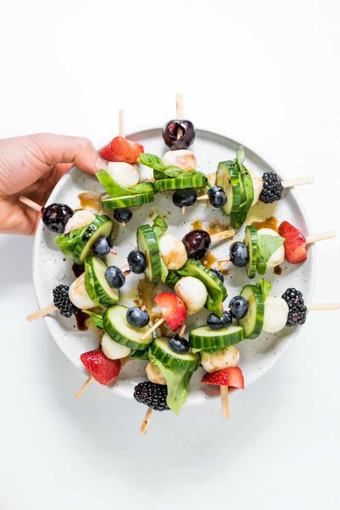 round plate of Summer Cucumber Bites on a Stick