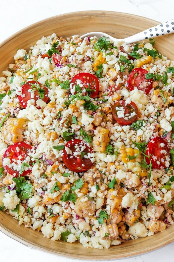 corn tomatoe salad garnished with cilantro