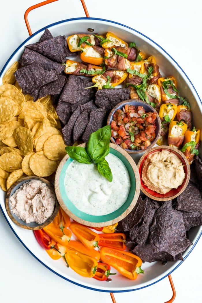beautiful tray with chips and salsa and dips