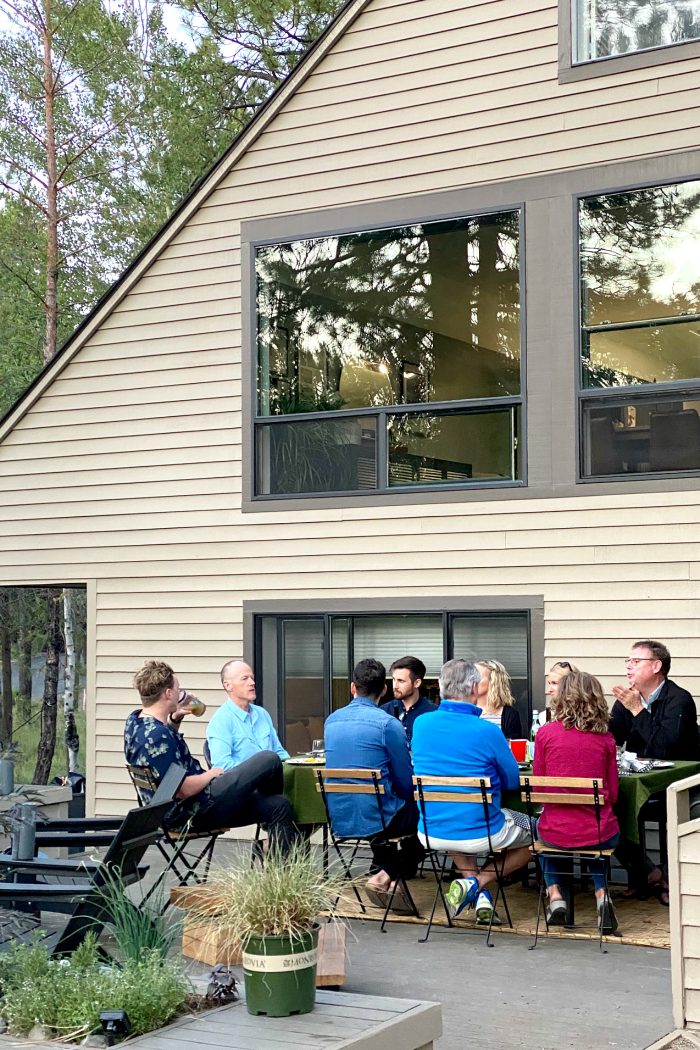 outside dinner guests around a table