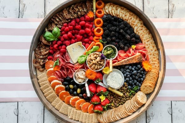 beautiful round board with rainbow colored foods