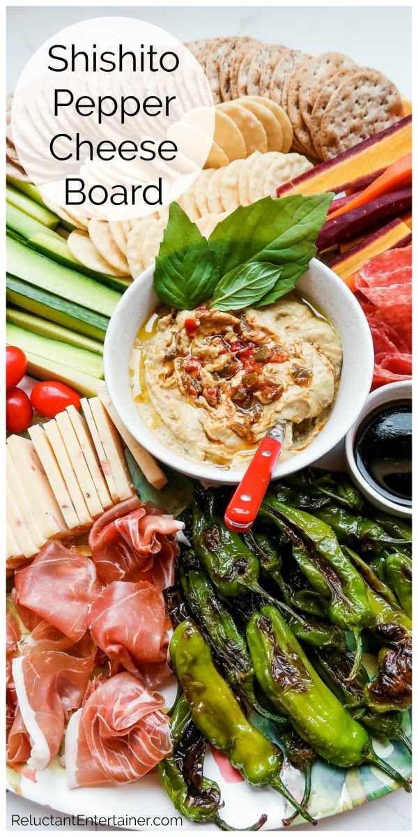 hummus in the center of a cheese board