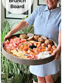 woman holding a Ham Cheese Brunch Board