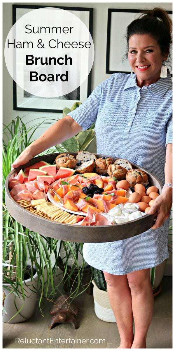 woman holding a Ham Cheese Brunch Board