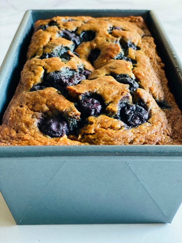 close up blueberries in a banana bread recipe