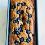 blueberry banana bread in a loaf pan
