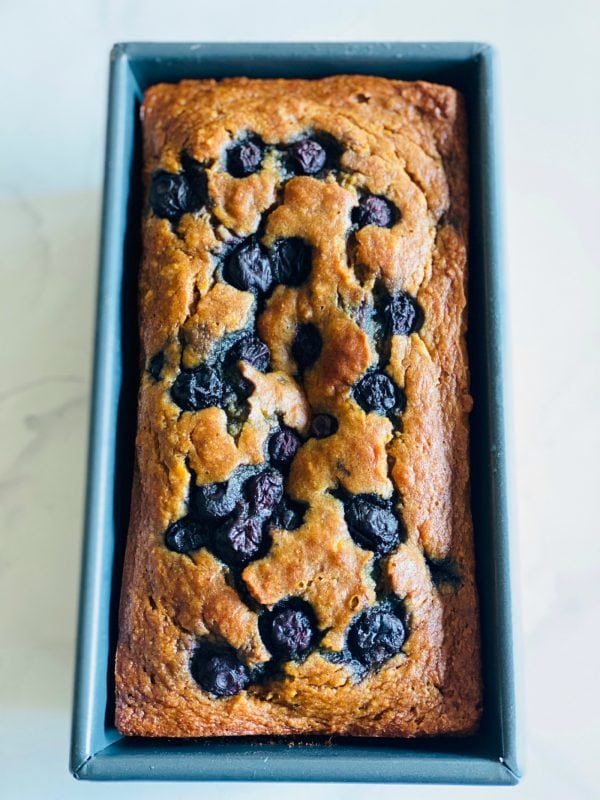 blueberry banana bread in a loaf pan
