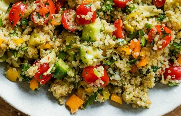 tomatoes and cucumbers in Herbed Quinoa Veggie Salad