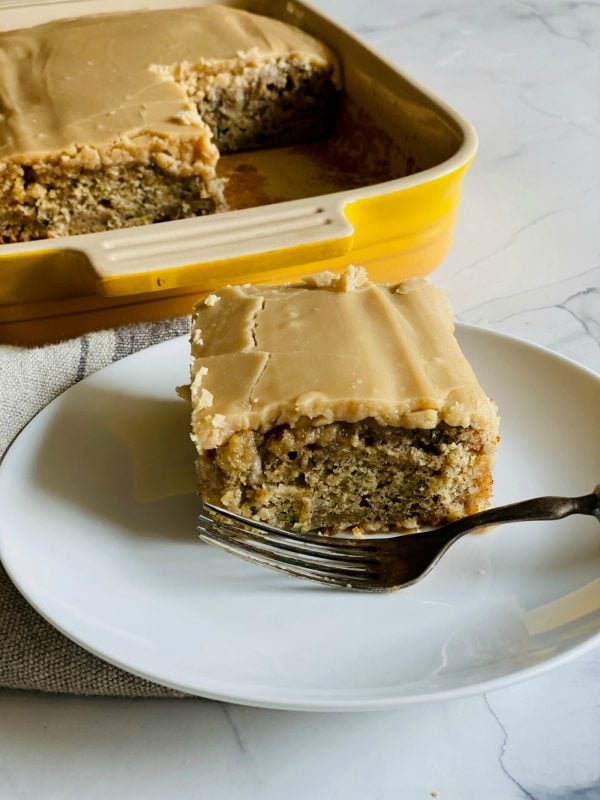 a square piecec of Zucchini Banana Cake with Frosting