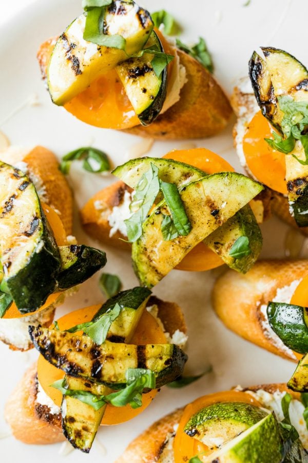 grilled zucchini toast with heirloom tomatoes