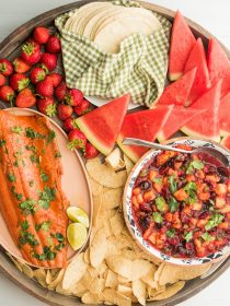 a round salmon taco dinner board